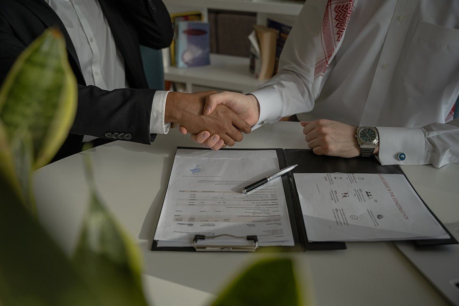 Business negotiation concluding successfully through an interpreter